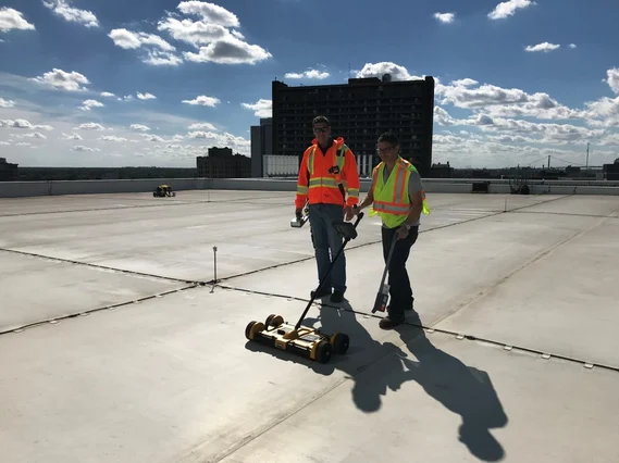 Two workers on rooftop